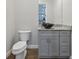 Modern bathroom with gray vanity, vessel sinks, and granite countertop at 3483 Conley St, College Park, GA 30337