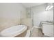 Bathroom features a large soaking tub, walk-in shower, and granite vanity at 3483 Conley St, College Park, GA 30337