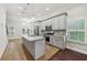 Modern kitchen with gray cabinets, granite counters, and island at 3483 Conley St, College Park, GA 30337