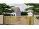 Modern sliding gate with a combination of wood and metal at 3483 Conley St, College Park, GA 30337