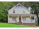 Charming light green two-story house with a porch at 3483 Conley St, College Park, GA 30337