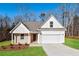 Two-story house with white siding and a two-car garage at 87 Wheelers Dr, Dallas, GA 30157