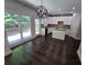 Eat-in kitchen with white cabinets, granite countertops, and dark hardwood floors at 1400 Village Creek Se Cir # 12A, Atlanta, GA 30316