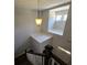 View of staircase leading to upper level with unique lighting fixture at 1400 Village Creek Se Cir # 12A, Atlanta, GA 30316