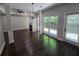 Open dining area with hardwood floors, fireplace, and access to backyard at 1400 Village Creek Se Cir # 12A, Atlanta, GA 30316