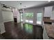 Spacious dining area with hardwood floors and a view of the kitchen and fireplace at 1400 Village Creek Se Cir # 12A, Atlanta, GA 30316