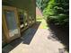 Private patio with adjacent grass and lush green trees at 1400 Village Creek Se Cir # 12A, Atlanta, GA 30316