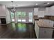 Bright dining area with hardwood floors, fireplace, and access to backyard at 1400 Village Creek Se Cir # 12A, Atlanta, GA 30316