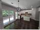 Eat-in kitchen with white cabinets, granite countertops, and dark hardwood floors at 1400 Village Creek Se Cir # 12A, Atlanta, GA 30316