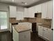 Kitchen with white cabinets, granite countertops, and an island at 1400 Village Creek Se Cir # 12A, Atlanta, GA 30316