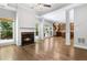 Open living room with hardwood floors, fireplace, and kitchen view at 1400 Village Creek Se Cir # 12A, Atlanta, GA 30316