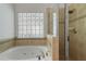 Bathroom with a large soaking tub and glass shower at 1400 Village Creek Se Cir # 12A, Atlanta, GA 30316