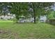 Backyard view showing a patio and a large grassy area at 1531 Piedmont Ne Rd, Marietta, GA 30066