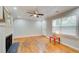Living room with hardwood floors, fireplace, and large windows at 1902 Canterbury St, Decatur, GA 30032