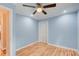 Light blue bedroom with hardwood floors and a closet at 1902 Canterbury St, Decatur, GA 30032