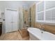 Spa-like bathroom with glass shower and soaking tub at 76 Misty View Ln, Acworth, GA 30101