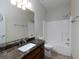 Bathroom with dark vanity and shower/tub combo at 76 Misty View Ln, Acworth, GA 30101