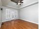 Main bedroom with hardwood floors and access to patio at 76 Misty View Ln, Acworth, GA 30101