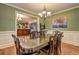 Bright dining room featuring a large table and chandelier at 252 Madison Park Dr, Grayson, GA 30017