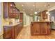 Spacious kitchen with granite countertops and dark wood cabinets at 252 Madison Park Dr, Grayson, GA 30017