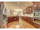 Kitchen with stainless steel appliances and wood cabinets at 252 Madison Park Dr, Grayson, GA 30017