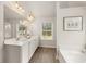 Spa-like bathroom with double vanity and soaking tub at 558 Abbott Se Ct, Atlanta, GA 30354