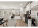Island kitchen with stainless steel appliances and granite countertops at 558 Abbott Se Ct, Atlanta, GA 30354