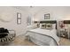 Bedroom with a queen bed, window, and armchair at 558 Abbott Se Ct, Atlanta, GA 30354