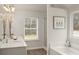 Elegant bathroom featuring double sinks and a separate shower at 558 Abbott Se Ct, Atlanta, GA 30354
