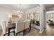 Elegant dining room with a large table and mirror at 558 Abbott Se Ct, Atlanta, GA 30354