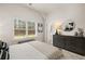 Spacious bedroom with large window and dresser at 558 Abbott Se Ct, Atlanta, GA 30354