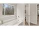 Bathroom boasting a garden tub and separate toilet at 558 Abbott Se Ct, Atlanta, GA 30354