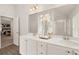 Double vanity bathroom with a large mirror and plenty of storage at 558 Abbott Se Ct, Atlanta, GA 30354