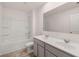 Bathroom with double vanity, a large mirror, and a bathtub at 3219 Champions Way, Loganville, GA 30052