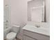 Clean bathroom with a single vanity, a bathtub, and a toilet at 3219 Champions Way, Loganville, GA 30052