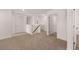 Upstairs hallway with access to bedrooms and bathroom at 3219 Champions Way, Loganville, GA 30052