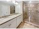 Main bathroom with double vanity and shower at 2286 Foley Park St, Snellville, GA 30078