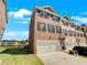 Brick townhome with a two-car garage and well-manicured lawn at 2286 Foley Park St, Snellville, GA 30078