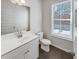 Simple bathroom with single vanity and toilet at 2286 Foley Park St, Snellville, GA 30078