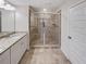 Elegant bathroom with granite countertop, large shower, and updated fixtures at 2286 Foley Park St, Snellville, GA 30078
