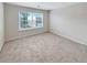 Spacious bedroom with neutral carpeting and large window at 2286 Foley Park St, Snellville, GA 30078