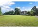 Large grassy backyard with a view of the house at 761 Hardage Farm Nw Dr, Marietta, GA 30064