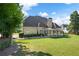 Back exterior of house showing sunroom and patio at 761 Hardage Farm Nw Dr, Marietta, GA 30064