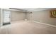 Finished basement room with exterior access and neutral decor at 761 Hardage Farm Nw Dr, Marietta, GA 30064