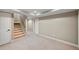 Finished basement features neutral walls, carpet, and ample space at 761 Hardage Farm Nw Dr, Marietta, GA 30064