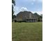 Back exterior of house with sunroom and large yard at 761 Hardage Farm Nw Dr, Marietta, GA 30064