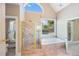 Bathroom featuring a large shower, garden tub, and arched window at 761 Hardage Farm Nw Dr, Marietta, GA 30064