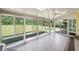 Bright sunroom with tile floors and sliding glass doors leading to backyard at 761 Hardage Farm Nw Dr, Marietta, GA 30064