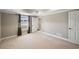 Bright basement bedroom with window, neutral walls, and carpet at 761 Hardage Farm Nw Dr, Marietta, GA 30064