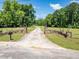 Long driveway with stone pillars and gates leading to a private home at 500 Cochran Rd, Covington, GA 30014